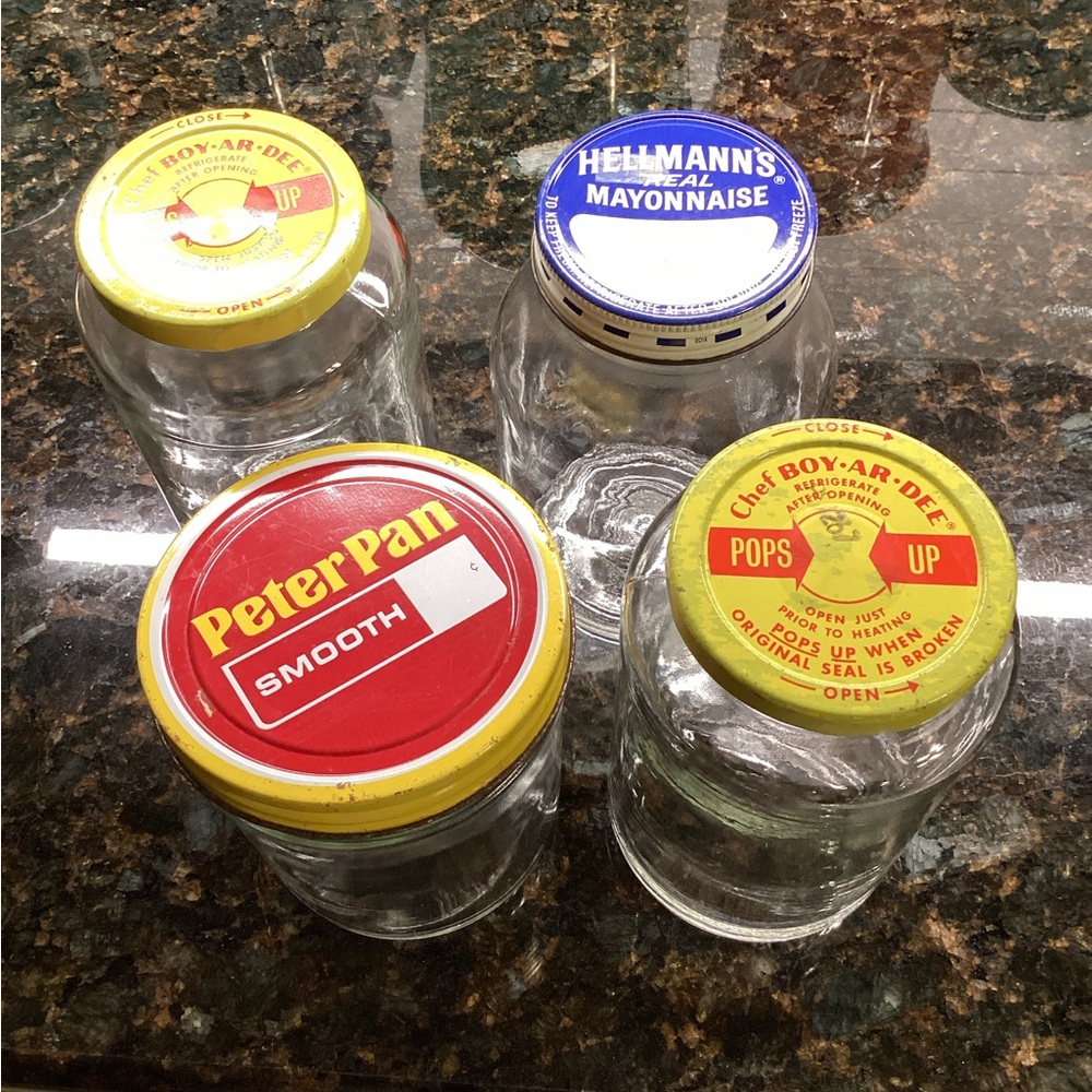 Group of Four Vintage Brand Name Glass Jars with Metal Lids